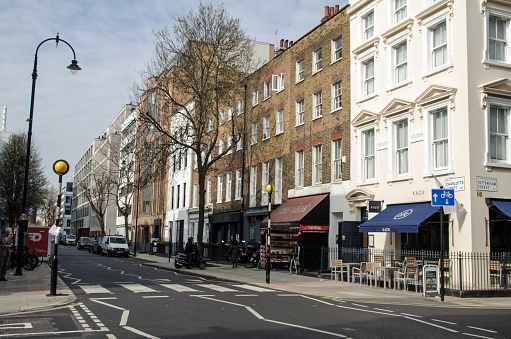 London, UK - March 21, 2022: View along the fashionable Charlotte Street in Camden, Central London.  The street is associated with the advertising industry and includes many popular restaurants.