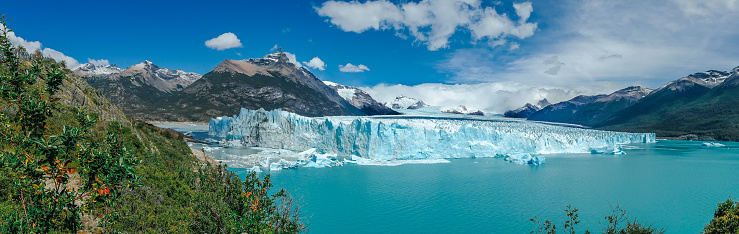Among the Earth's most dynamic and accessible ice fields, Glaciar Perito Moreno is the stunning centerpiece of the southern sector of Parque Nacional Los Glaciares. Locally referred to as Glaciar Moreno, it measures 30km long, 5km wide and 60m high, but what makes it exceptional in the world of ice is its constant advance – up to 2m per day, causing building-sized icebergs to calve from its face.