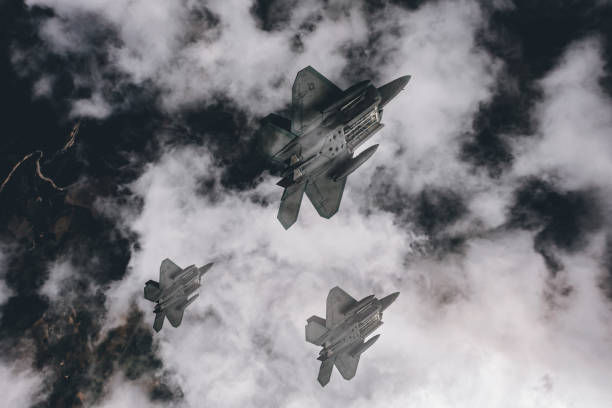 istock Jet fighters flying over the clouds. 1393851467
