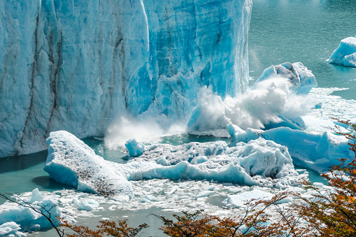 Close-up of a piece of ice breaking of from the glacier. Perito Moreno glacier in Patagonia, Argentina