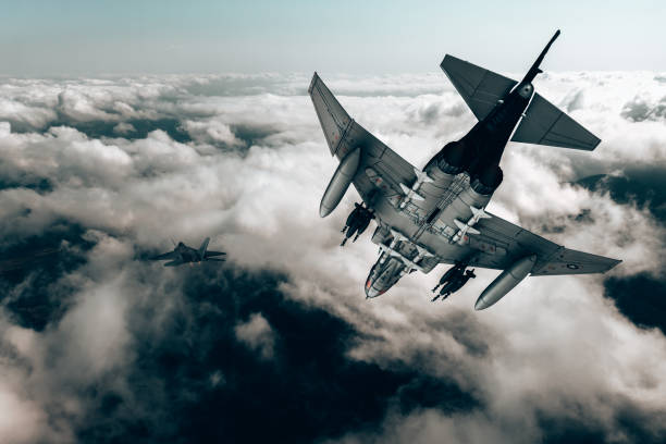 istock Jet fighters flying over the clouds. 1393851539