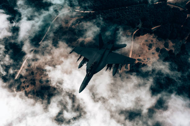 istock Jet fighters flying over the clouds. 1393851805