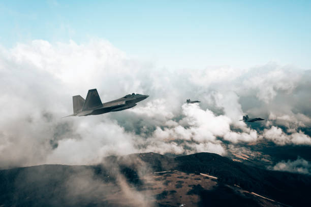 istock Jet fighters flying over the clouds. 1393851833