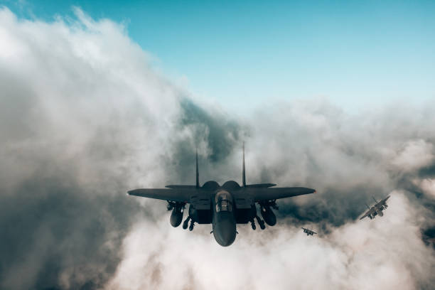 istock Jet fighters flying over the clouds. 1393852466