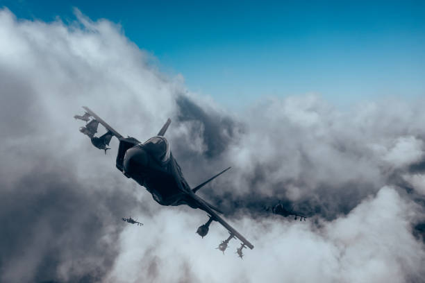 istock Jet fighters flying over the clouds. 1393852560