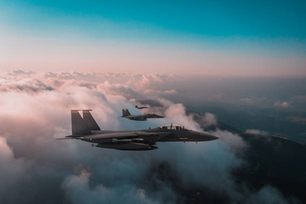istock Jet fighters flying over the clouds. 1393852595