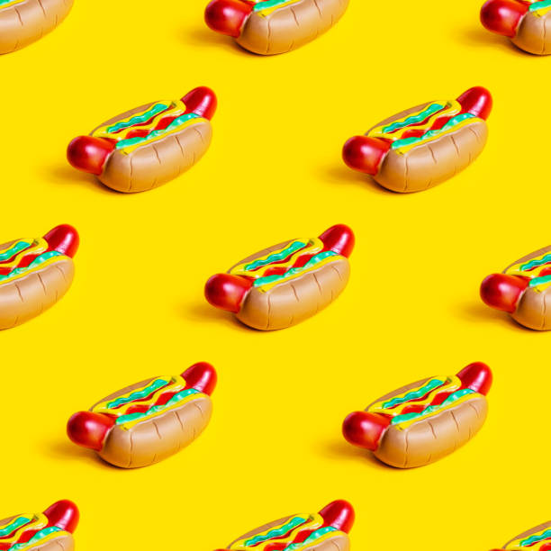 istock Toy American rubber hot dog repeat seamless pattern on bright yellow background 1393853138