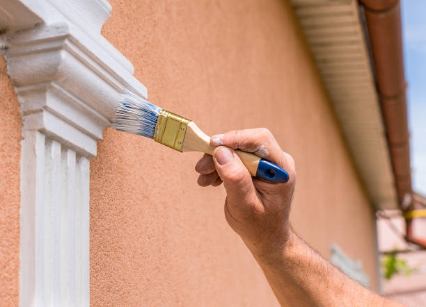 istock man's hand painting a window sill close up. homework. 1393854754