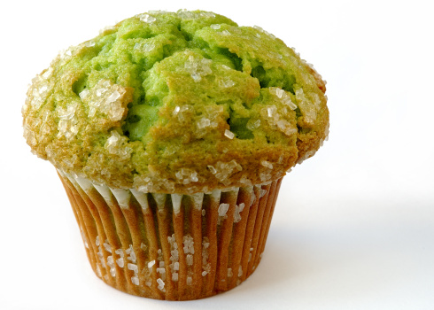 Frshly baked pistachio muffin sprinkled with sugar