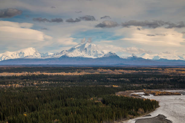 istock dramatic view of the snow capped Wrangell-St. Elias mountain range viewed from the Copper River in Alaska . 1393855506