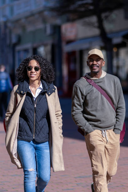 istock Afro couple walking in the city 1393855657