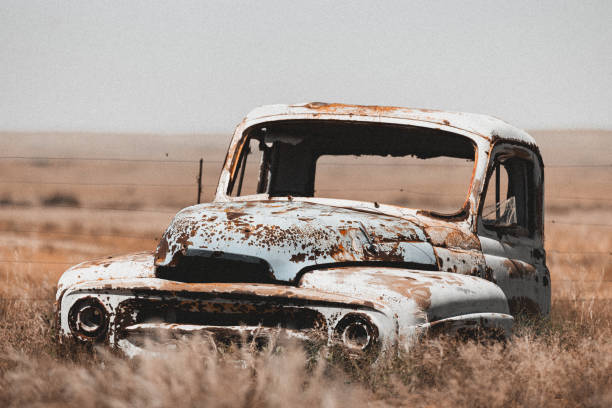 istock Old car in the dessert 1393856883