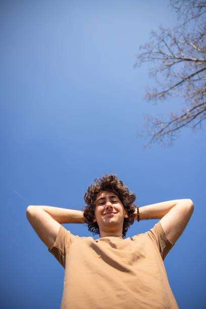 istock Joyful Caucasian young man enjoy the sunny day 1393859430