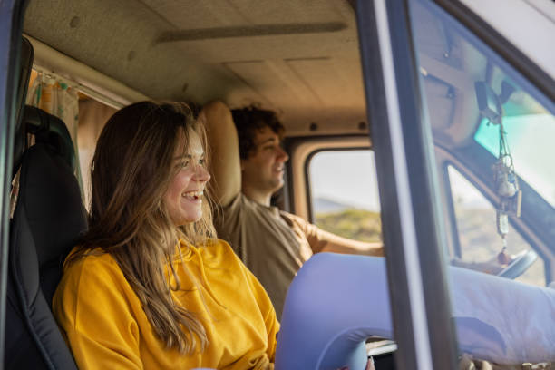 istock Young Caucasian couple ejoy the journey with their camper van 1393860050