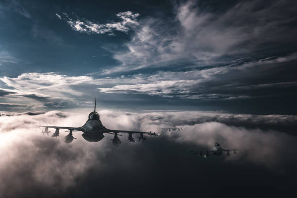 istock Jet fighters flying over the clouds. 1393862794