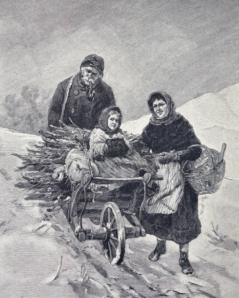 istock Winter worries: couple with child with collected brushwood on a wheelbarrow 1393862869