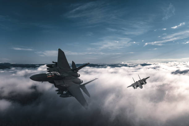 istock Jet fighters flying over the clouds. 1393863275