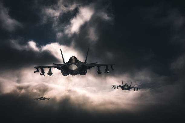 istock Jet fighters flying over the clouds. 1393863888
