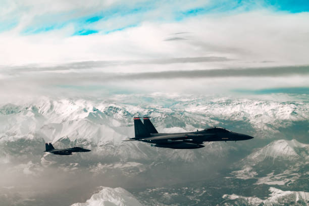 istock Jet fighters flying over the clouds. 1393864546