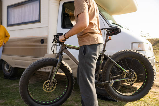 istock Young Caucasian man carrying the bicycle 1393865828