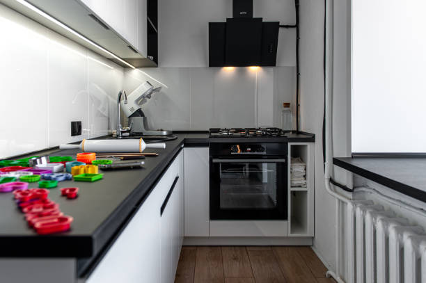 istock Kitchen interior with cookie cutters, cooking cookies. 1393868158