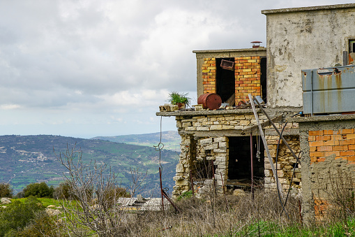 abandoned house on a mountains background in unpopulated village in Cyprus