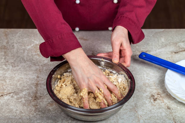 istock The process of preparing a homogeneous mass of dough for baking 1393870202