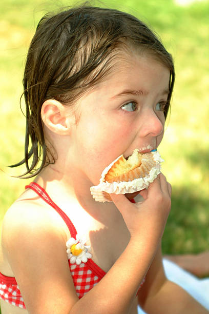 Girl Eating a Cupcake