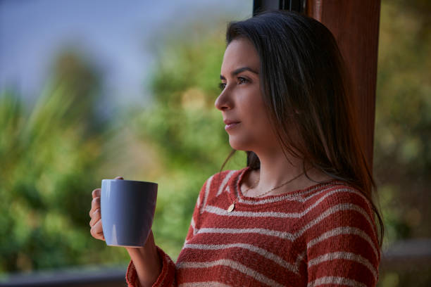 istock Hispanic young woman drinking coffee at morning 1393872028