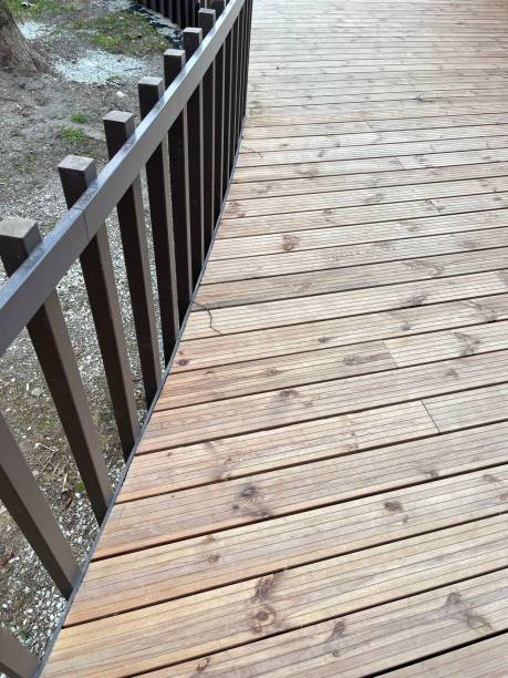 istock Background - wooden stairs and black railings 1393872944