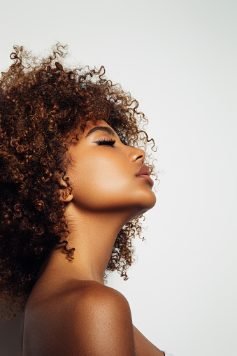Beautiful afro girl with curly hairstyle