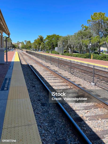 Bricked Commuter Rail Station Platform Located On A Double Tracked Line At Winter Park Florida Which Serves Interstate Rail Travelers Also Stock Photo - Download Image Now
