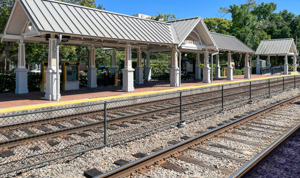 istock Modern, but classically designed, commuter rail station on a double tracked line at Winter Park, Florida which serves interstate rail travelers, also. 1393877262
