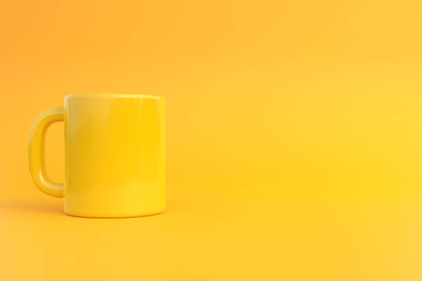 istock Yellow Ceramic cup or empty mug for coffee, drink or tea on yellow background 1393877320