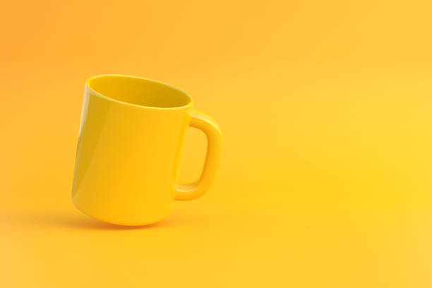 istock Yellow Ceramic cup or empty mug for coffee, drink or tea on yellow background 1393877429