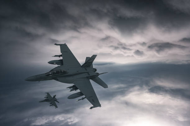 istock Jet fighters flying over the clouds. 1393878188