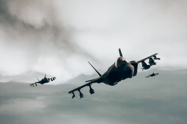 istock Jet fighters flying over the clouds. 1393878194