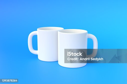 istock Two white ceramic cup or empty mug for coffee, drink or tea on blue background 1393878264