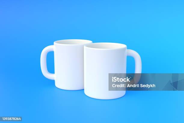 Two White Ceramic Cup Or Empty Mug For Coffee Drink Or Tea On Blue Background Stock Photo - Download Image Now