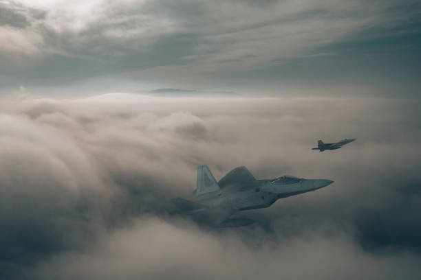 istock Jet fighters flying over the clouds. 1393878349