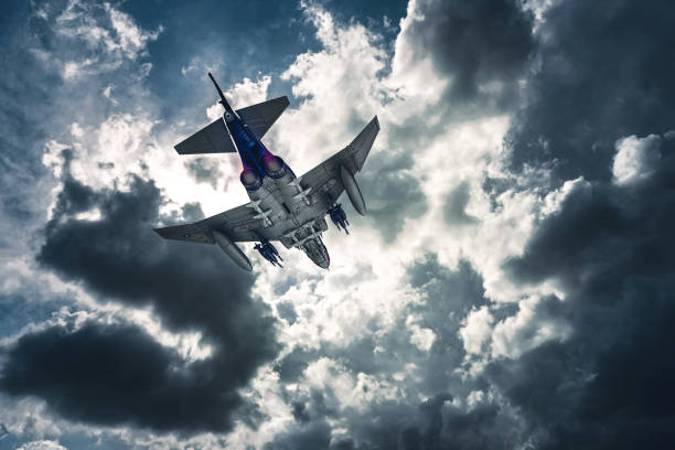 istock Jet fighters flying over the clouds. 1393878661