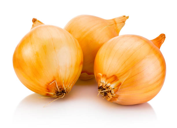 istock Fresh bulbs of onion isolated on white background 1393879450