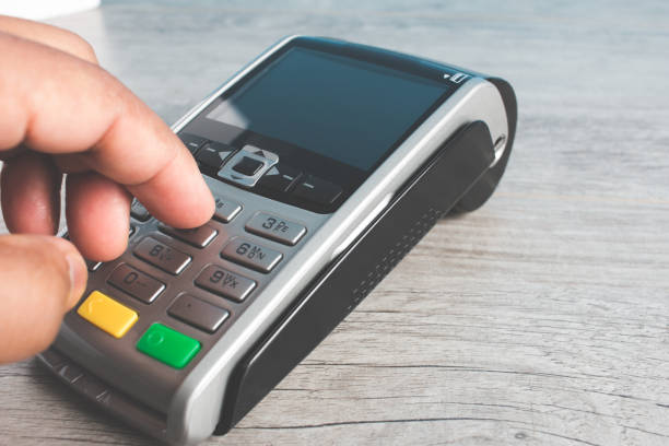istock Closed hand socket by entering code in payment terminal. concept purchases with cards 1393879908