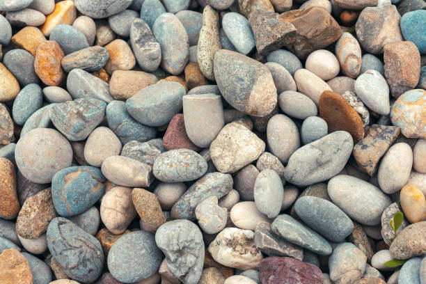 istock Abstract nature pebbles background, texture. Sea pebble beach. Stone background 1393880717