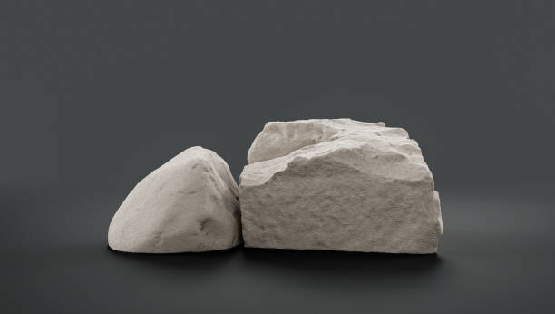 istock Single color white rocks in a flat grey color background  monochrome rock model 1393880758