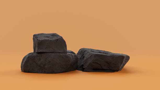 istock Isolated dark rocks in a yellow background  monochrome rock model 1393881016