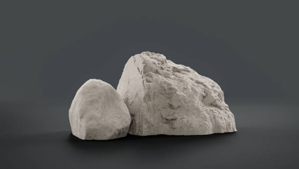 istock Single color white rocks in a flat grey color background  monochrome rock model 1393881035