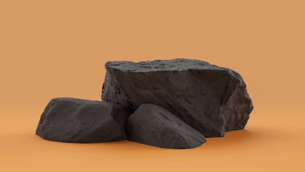 istock Isolated dark rocks in a yellow background  monochrome rock model 1393881114