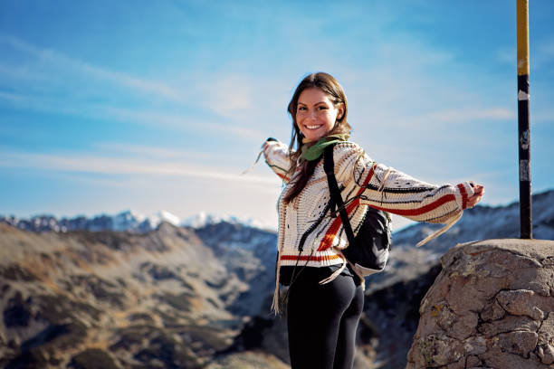 Hiker woman is enjoying view in a mountain