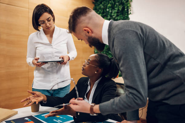 istock Multicultural team working together in office and having a meeting 1393883147